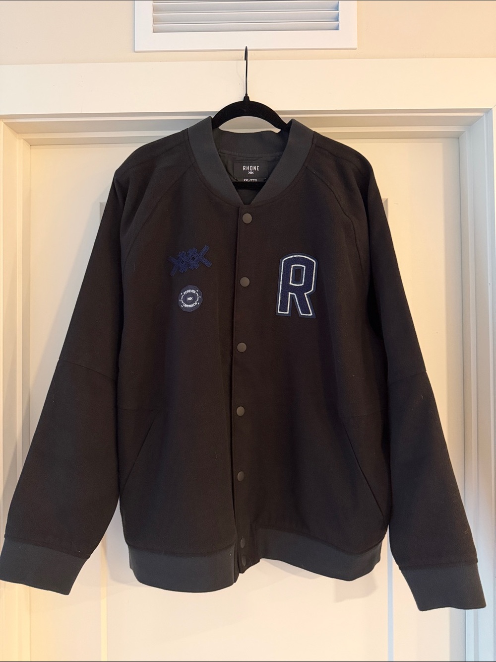 RHONE Black Letterman-Style Bomber Jacket with Navy Patch Details